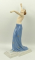 A Royal Dux porcelain figure, by Schaff, modelled as a semi clad woman standing with her arms out st... 