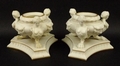 A pair of Parian ware urns, late 19th century, covers lacking, supported by three harpies each on si... 
