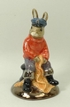 A Royal Doulton prototype figure of Fisherman Bunnykins, modelled with a red jumper, silver lustre t... 