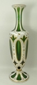 A Bohemian green flashed glass vase, late 19th century, of baluster form overlaid with opaque glass ... 
