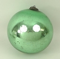 A 19th century glass watch's ball, green mercury, the finial pressed metal with a ring, 13cm diamete... 