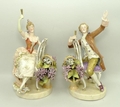 A pair of Sitzendorf porcelain figures, late 19th century, of a gallant and lady modelled seated on ... 