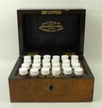 A Davies & Co Homeopathic Chemist's set, containing 24 vials within a burr walnut box, 9.5 by 7.5 by... 