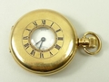 A Waltham 18ct gold half hunting cased, keyless wind pocket watch, white enamel dial bearing Roman n... 
