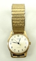 A Record gentleman's 9ct gold circular cased wristwatch, champagne dial bearing Arabic numerals, bac... 