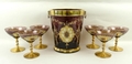 A Murano amethyst glass martini set, circa 1980's, with twin handled ice bucket with gilt rococo and... 