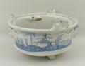 An English Delftware blue and white bowl, dated 1787, of circular, pierced form with three applied m... 