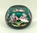 A William Manson, Caithness, faceted glass paperweight decorated with a ladybird and flowers, limite... 