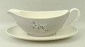 A Royal Doulton porcelain part dinner service decorated in the 'Frost Pine' pattern, comprising; mea... 