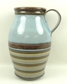 A Denby pottery water jug of baluster form with banded decoration against a duck egg blue ground, 36... 