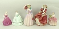 A group of Royal Doulton figures comprising Miss Demure HN1402, Top o' the Hill HN1834, and Cissie H... 