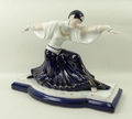 A Sevres style porcelain figure of a dancer modelled in out swept pose, blue and white with gilt hig... 