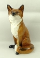 A Beswick pottery fireside model of a fox, modelled in seated pose, no 2348, printed mark, 31cm high... 