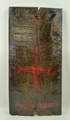 A Medieval wood panel painted with a coat of arms, Argent Cross Moline Grules, with label verso of p... 