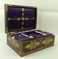 A Victorian painted and gilt tooled red morocco sewing box, opening to reveal a purple silk fitted i... 