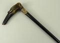 A Victorian ebony smoking walking stick, the handle carved as a hound's head, embossed brass ferrule... 