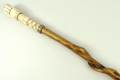 A Chinese walking stick with marine ivory carved handle in the form of a fist gripping a snake, sign... 
