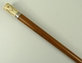 A French malacca walking stick, late 19th century, with an ivory handle pique decorated with swags a... 