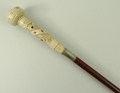A Victorian stained beech 'smell me' walking stick, the screw top bone handle carved with leaves, be... 