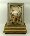A reproduction musical automaton of a seated courtesan, in a bi colour metal frame and velvet covere... 