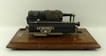 A Guy's Britannic calculating machine, no 22, cased, 36 by 18 by 15cm.