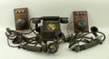 A collection of three 1920's and 1930's telephones, and a ceramic earphones headset. (6)