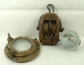An oval brass port hole, 33 by 26cm, a Sestrel speed boat compass, and a rigging wooden and iron dou... 