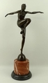 An Art Deco style bronze figure, after J Philippe, of an exotic dancer mounted on a red marble socle... 