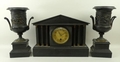 A late Victorian slate clock garniture, circa 1890, the clock of architectural form, with three colu... 