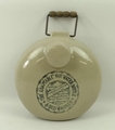 An Old Fulham Pottery stoneware 'The Adaptable Hot Water Bottle and Bed Warmer, with wooden handle, ... 
