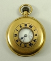 An 18ct gold half hunting cased, keyless wind pocket watch, Rotherhams of London, enamel dial bearin... 