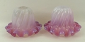 A pair of Victorian opaline and cranberry glass oil lamp shades of fluted form with frilled rims, 10... 