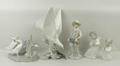 A quantity of Lladro porcelain figurines comprising a seagull modelled on a leafy branch, group of t... 
