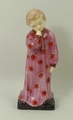 A Royal Doulton prototype figure modelled as 'Darling' in a floral patterned pink nightgown, raised ... 