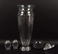 A Rosenthal engraved glass vase, 13 by 32cm, two Baccarat cut crystal eggs with square stands, a Dau... 