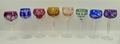 A harlequin set of Continental coloured hoch glasses raised on faceted stems, 18 to 20cm. (8)