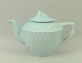 A child's turquoise blue pottery part tea service, circa 1930's, comprising tea pot, cream jug, suga... 