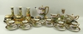 A Noritake porcelain nine piece dressing table set, bearing marks for 1908, painted with a rural sce... 