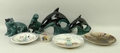 A quantity of Poole pottery animals comprising a badger, 737, otter and fish, and two graduated dolp... 