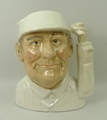 A Royal Doulton prototype pottery character jug modelled as the 'Golfer', painted face but otherwise... 