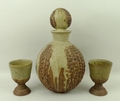 Bernard Rooke: a studio pottery flagon, with corn on the cob low relief decoration, chocolate glaze ... 