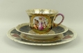 A Bohemian porcelain part tea service, early 20th century, reserve decorated, after Kaufmann, with c... 