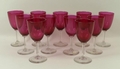 A collection of cranberry wine glasses, 12.5cm. (11)