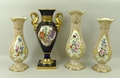 A garniture set of Rockingham vases, in oyster colour ground with reserves of floral decoration, wit... 