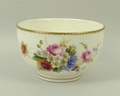 A Royal Worcester bowl, hand painted with flowers, signed 'E Phillips', with gilded rim and border, ... 