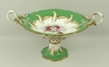 A Ridgways porcelain dessert service, early 18th century, painted with floral sprays against a yello... 