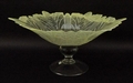 A clear glass tazza, 20th century, the bowl of flower form with yellow striated edge raised on knopp... 