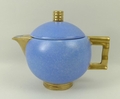A Carlton Ware bachelor tea set, Moderne pattern in blue ground with gold handles, comprising tea po... 