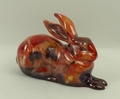 A Royal Doulton prototype figure of a recumbent hare, painted in sung colours, subsequently HN2592, ... 
