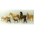 A group of Beswick horses, comprising a Shire horse, two Palomino's one in gloss finish, the other m... 